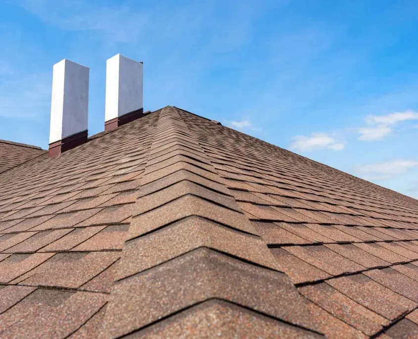 Corner view of a commercial condo with shingle rooftop