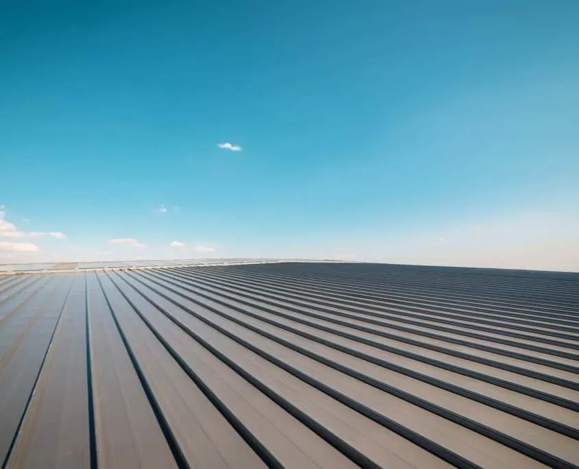 Metal panel building roof construction