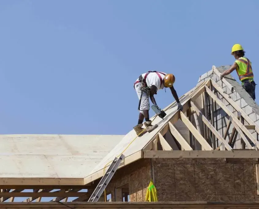 New construction of a rooftop with workers