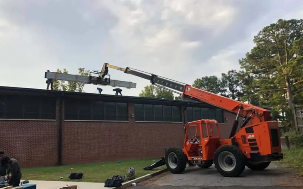 NewImageRoof_Team bringing materials to rooftop