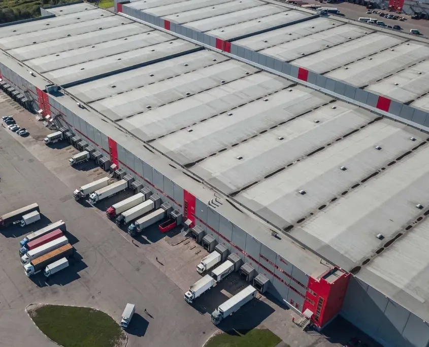 Overhead view of a grey and red distribution center
