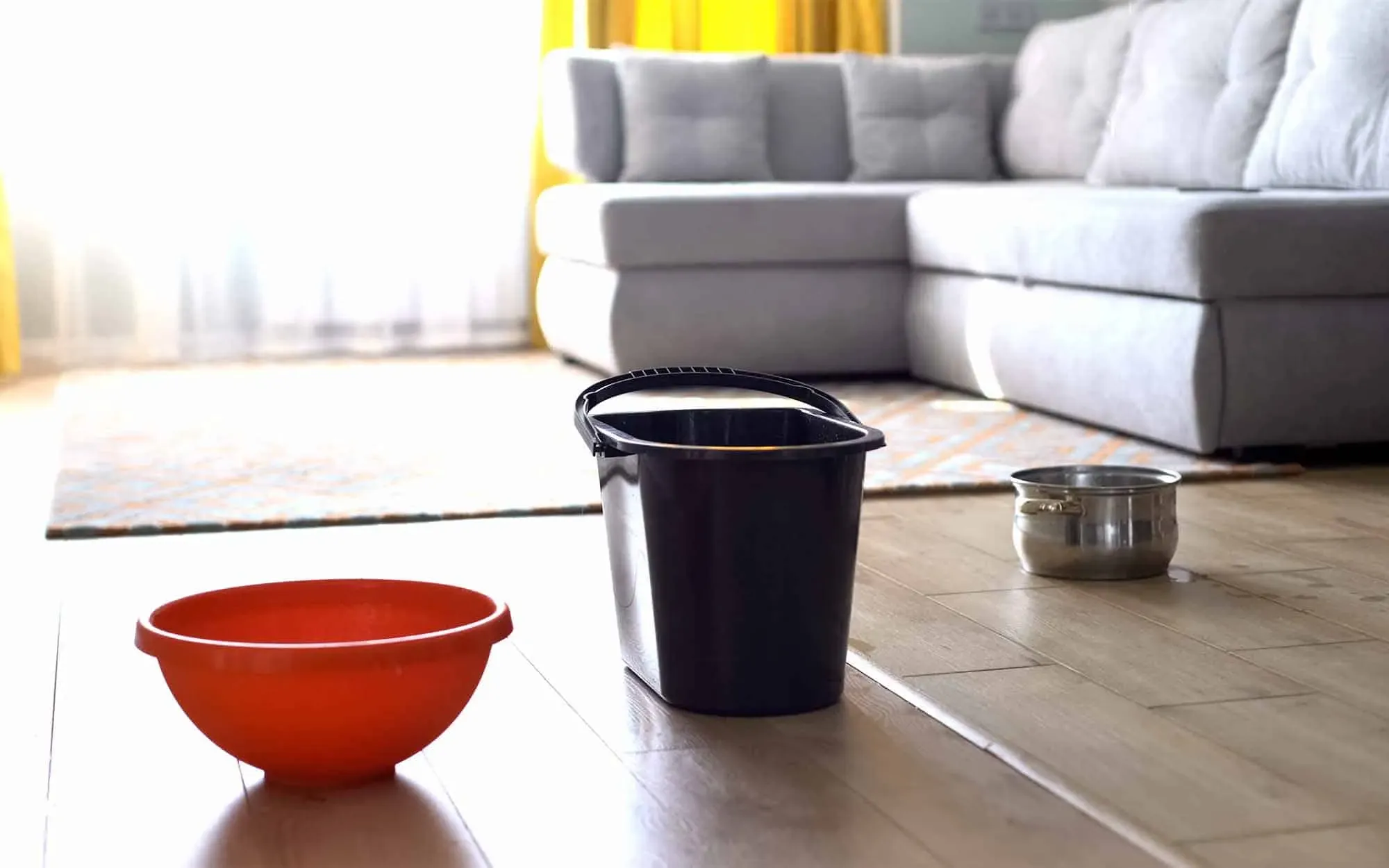 Residential Roof leaking buckets on the floor