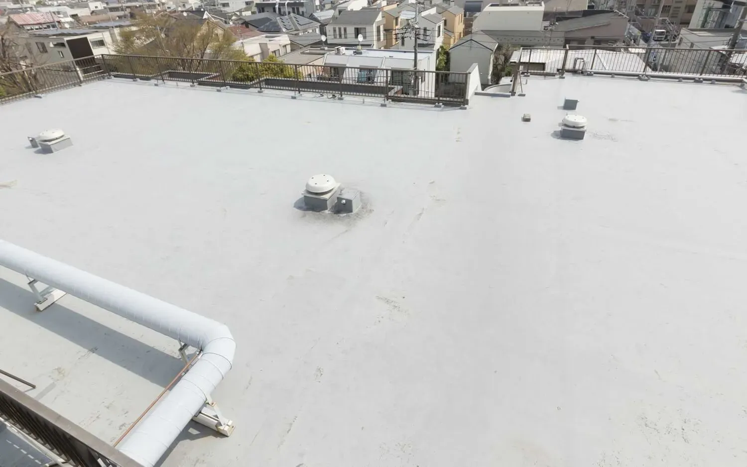 White commercial building with spray foam rooftop