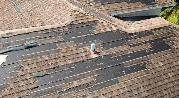 apartment building missing shingles