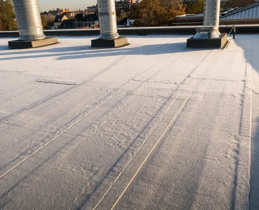 close up of flat top roof that has white panel waterproofing applied