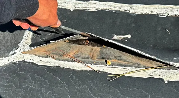 damaged flat membrane roofing system