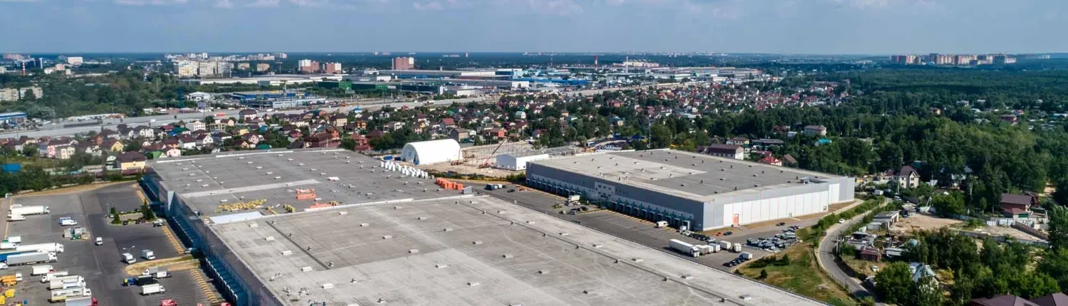 multiple buildings with commercial roof in a city