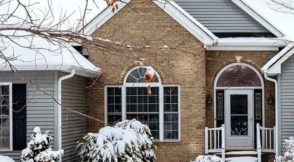 snow covered gutters and downspouts