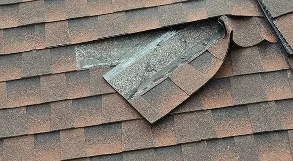 wind damaged asphalt shingle